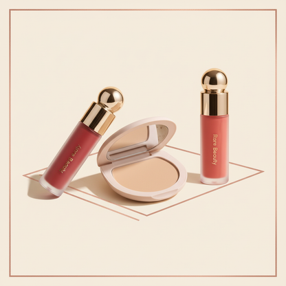 Rare Beauty Glow Vault trio featuring pressed finishing powder, liquid blush, and tinted lip oil